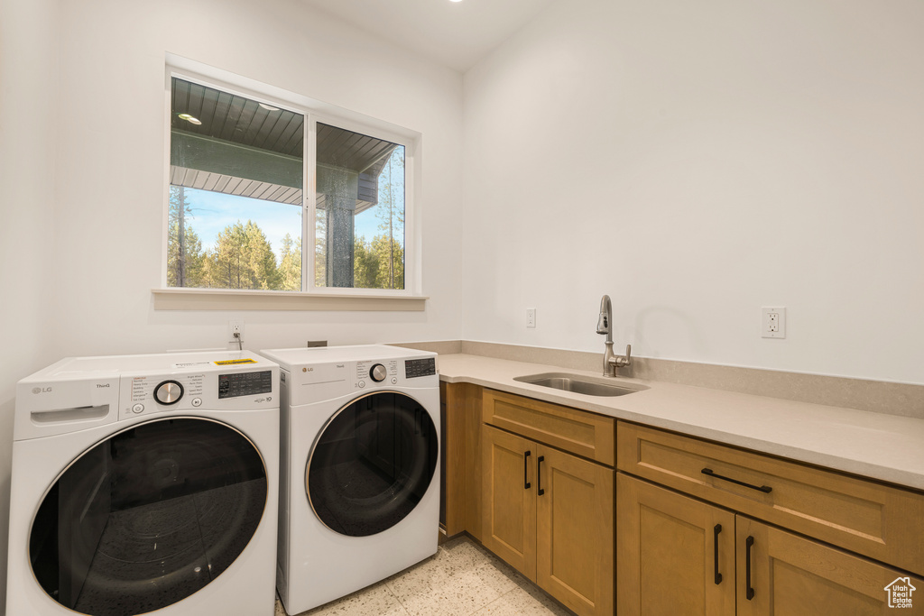 Washroom with washer and dryer and cabinet space