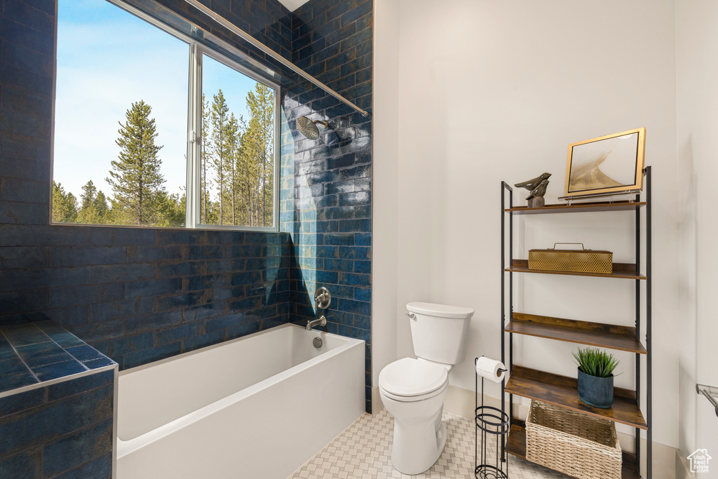 Full bath with toilet and shower / tub combination