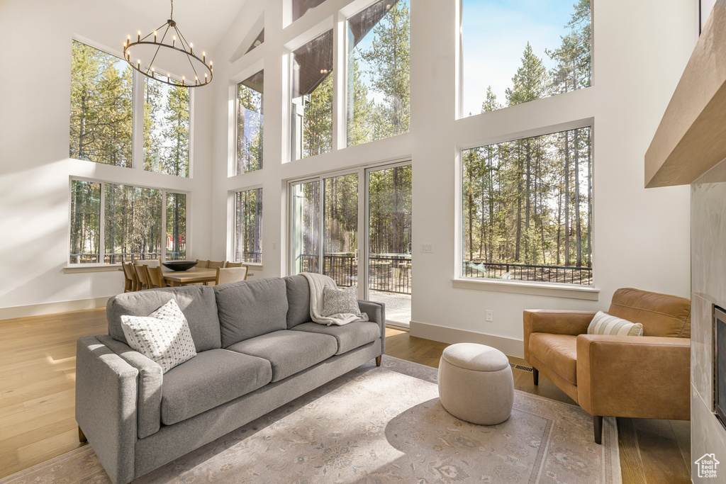 Sunroom / solarium featuring a chandelier