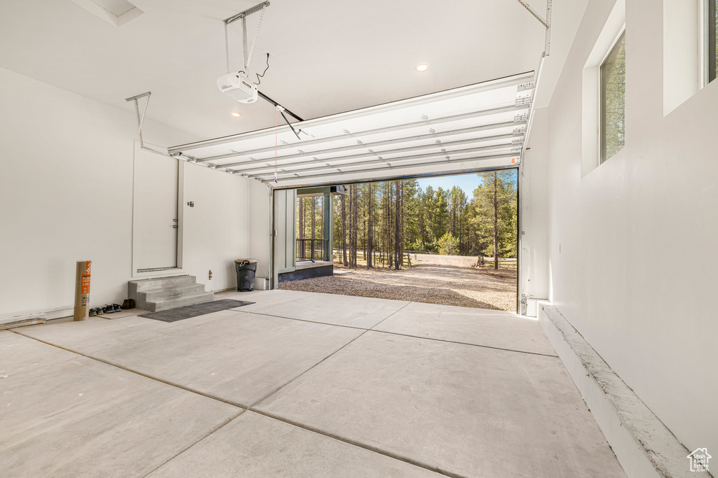 Garage featuring a garage door opener