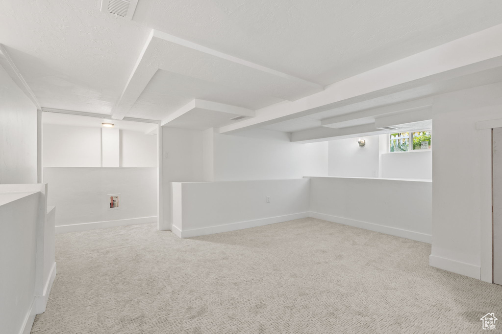 Basement with carpet and baseboards