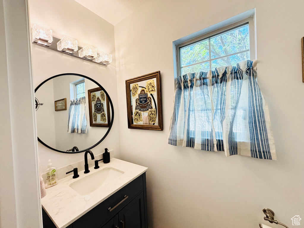 Bathroom featuring healthy amount of natural light and vanity
