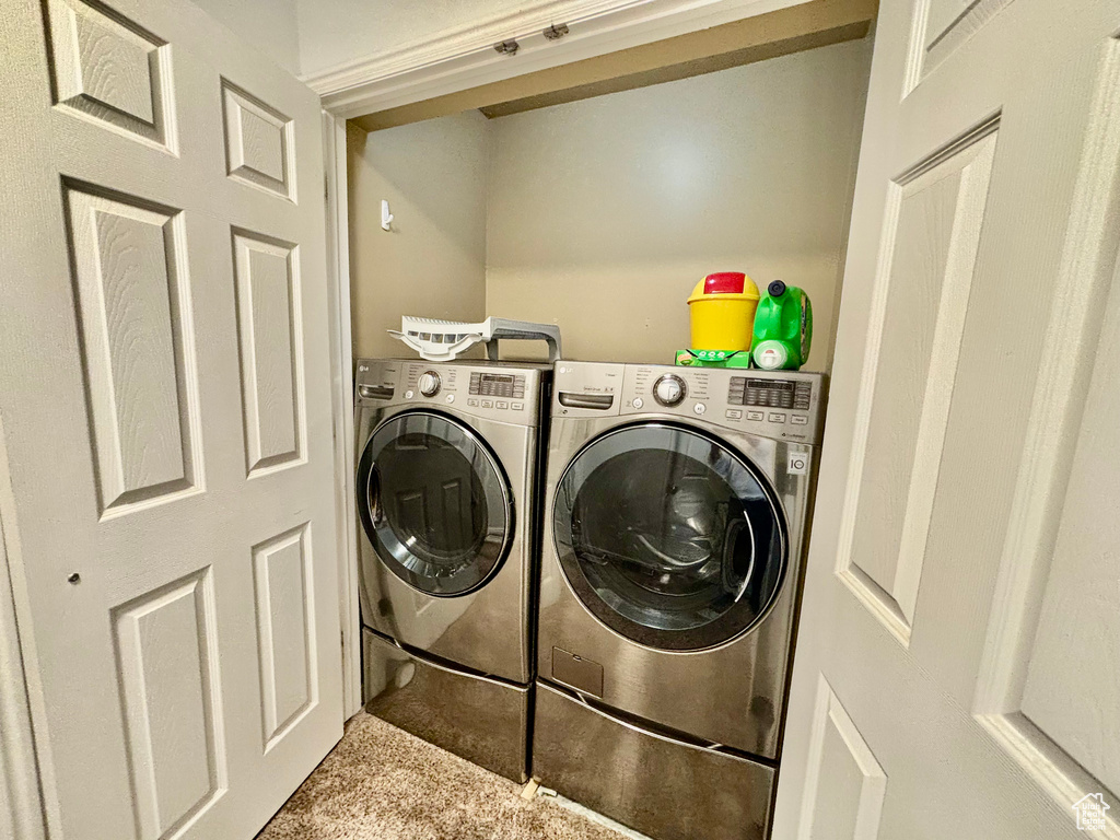 Laundry room featuring washer and clothes dryer