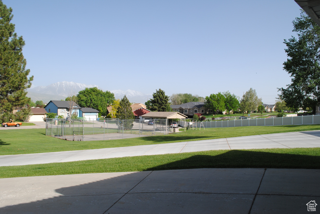 View of yard featuring a residential view and a mountain view