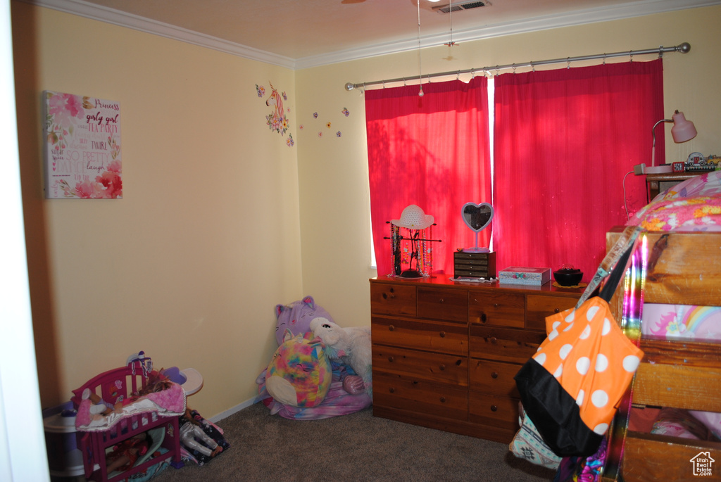 Bedroom featuring carpet and crown molding