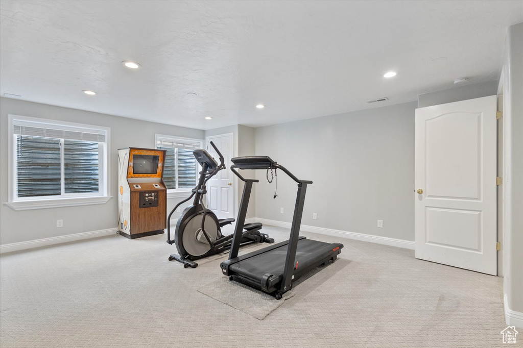 Exercise room featuring baseboards, carpet flooring, and recessed lighting