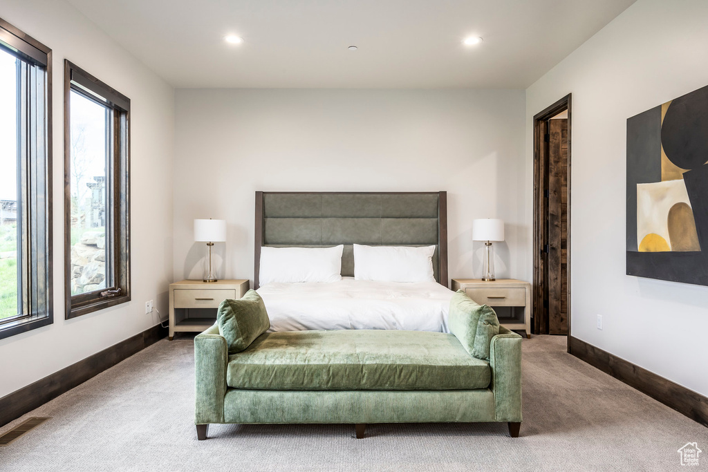 Carpeted bedroom featuring recessed lighting and baseboards