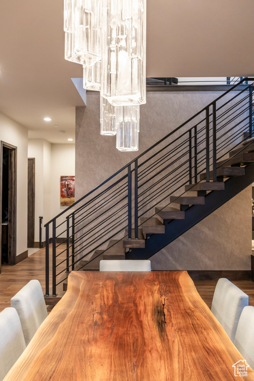 Stairs featuring wood finished floors, recessed lighting, and baseboards