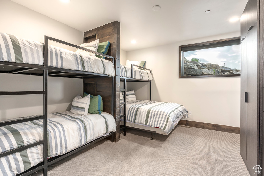 Bedroom with carpet floors, baseboards, and recessed lighting