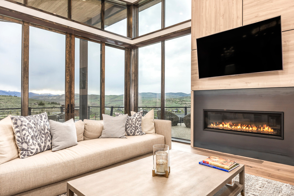 Living room with wood finished floors and a fireplace