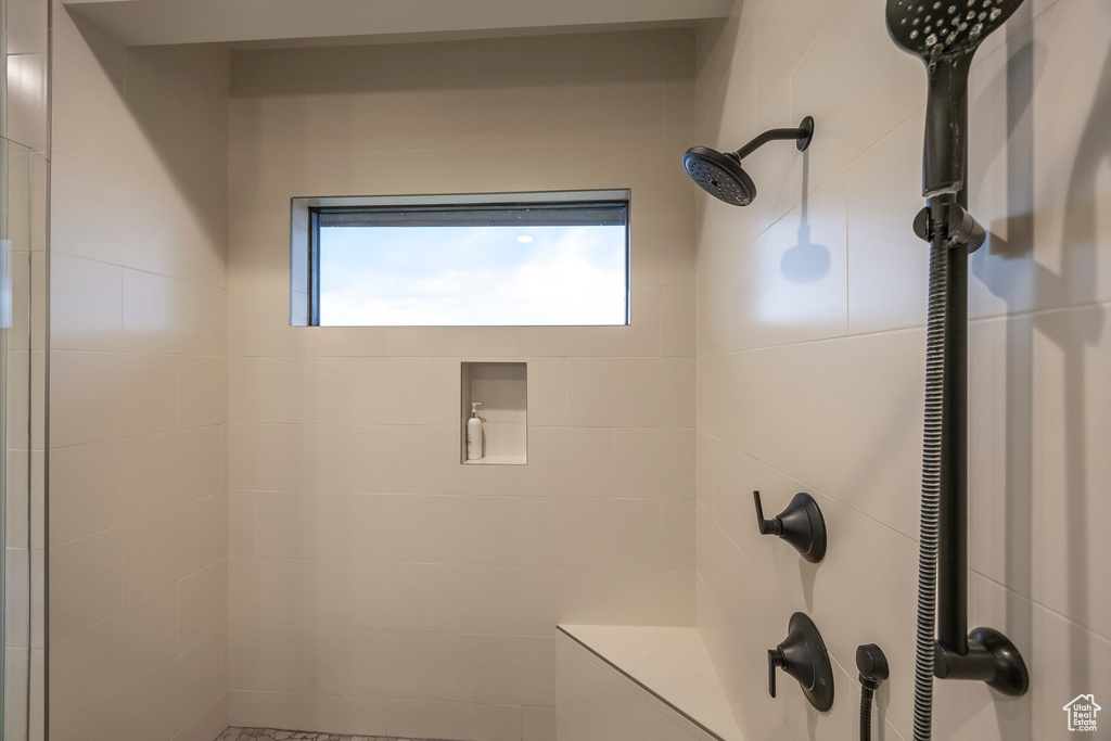 Bathroom with tiled shower