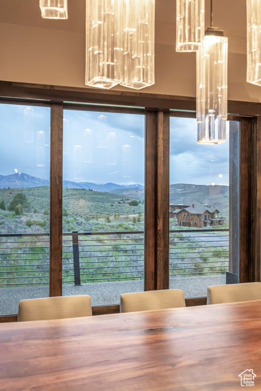 Dining area featuring a mountain view and plenty of natural light