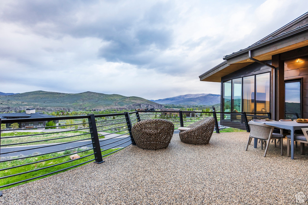 View of patio / terrace with a mountain view and a balcony