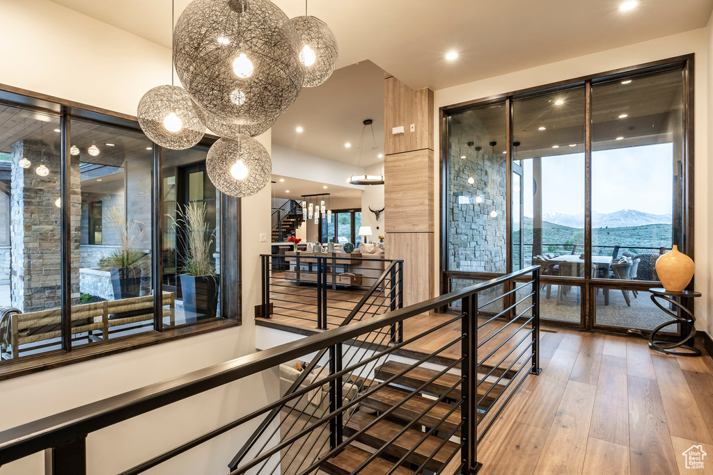 Hall featuring a mountain view, hardwood / wood-style floors, a chandelier, plenty of natural light, and recessed lighting