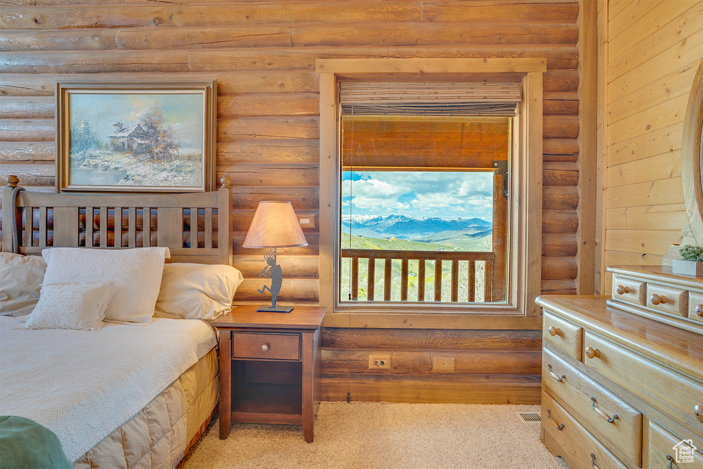 Bedroom with log walls