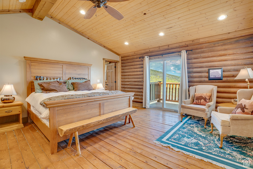 Bedroom with access to exterior, wood ceiling, rustic walls, light wood-type flooring, and lofted ceiling