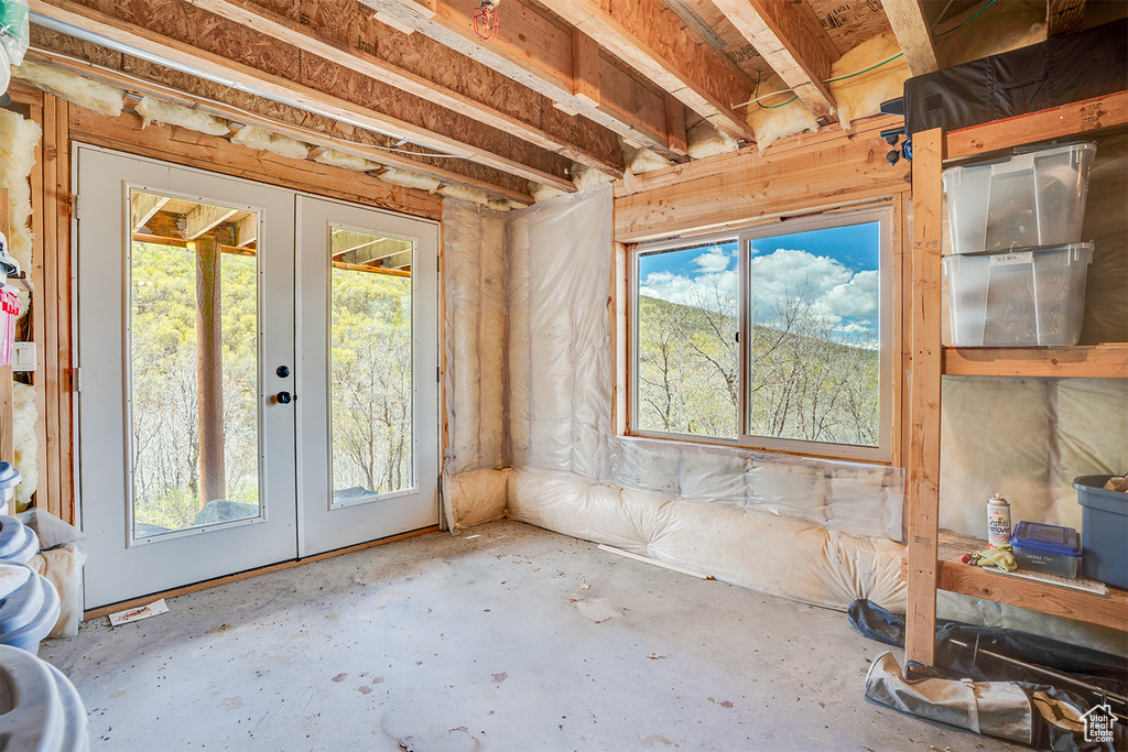 Unfurnished sunroom with french doors