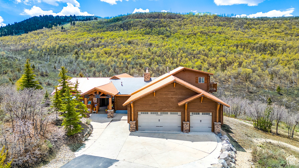 View of subject property featuring a forest