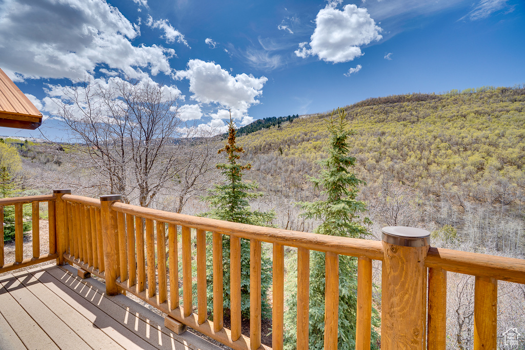 Wooden deck with a wooded view