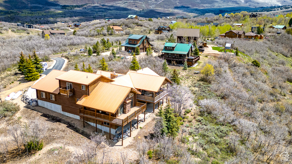 View from above of property with a mountain backdrop