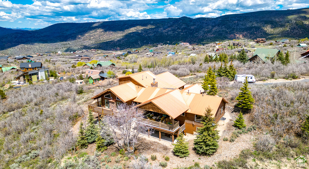 View from above of property with a mountain backdrop