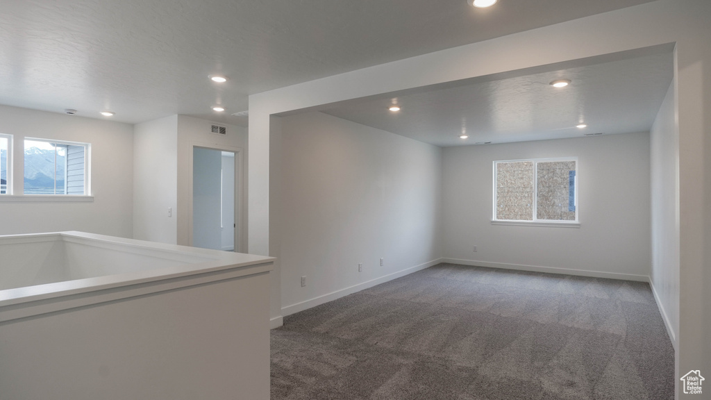 Unfurnished room with carpet flooring, recessed lighting, and baseboards
