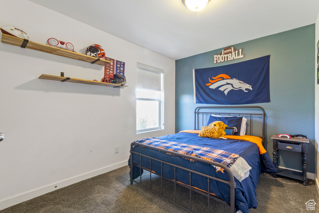 Carpeted bedroom with baseboards