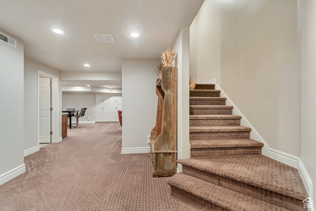 Stairs featuring carpet flooring, recessed lighting, and baseboards