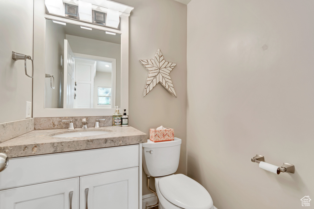 Bathroom featuring toilet and vanity