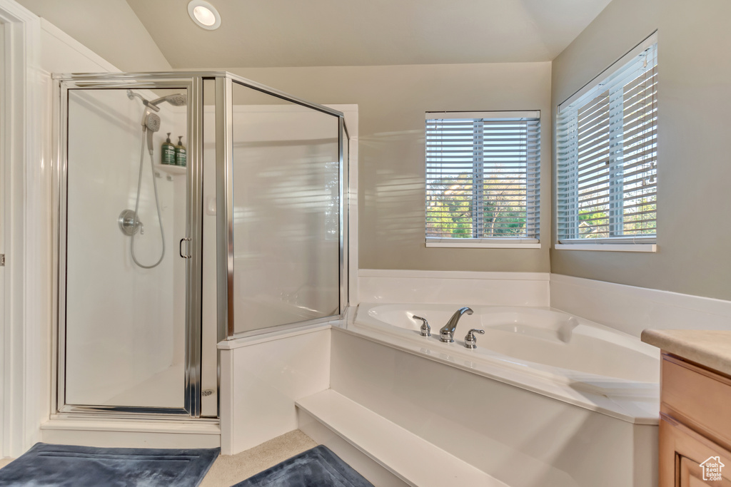 Full bath featuring a shower stall, a garden tub, recessed lighting, and vanity