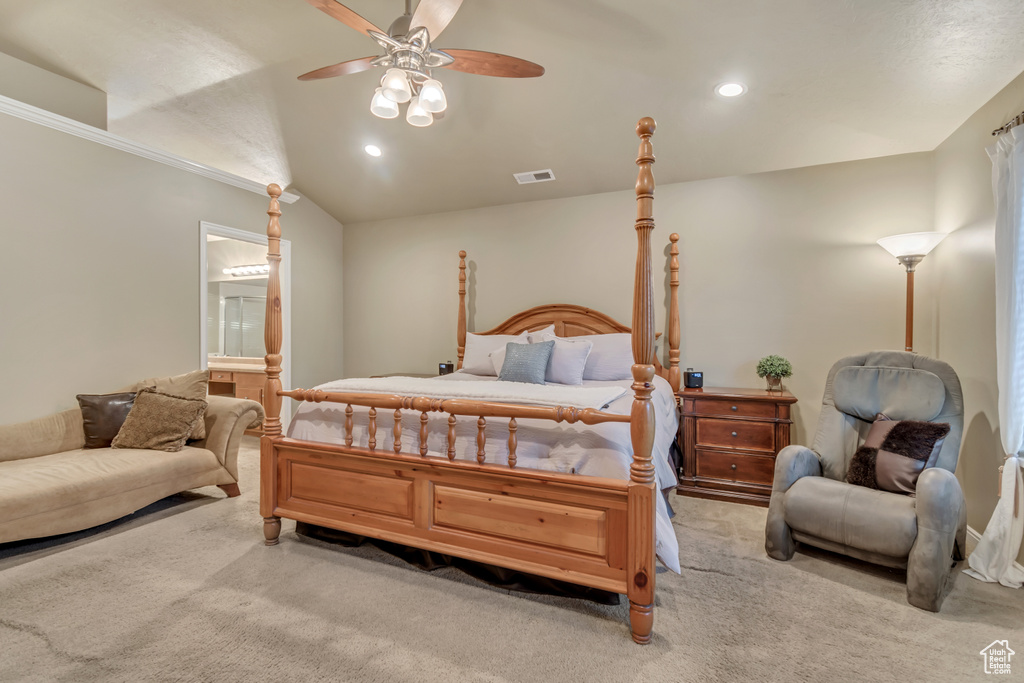 Carpeted bedroom with connected bathroom, recessed lighting, a ceiling fan, crown molding, and lofted ceiling