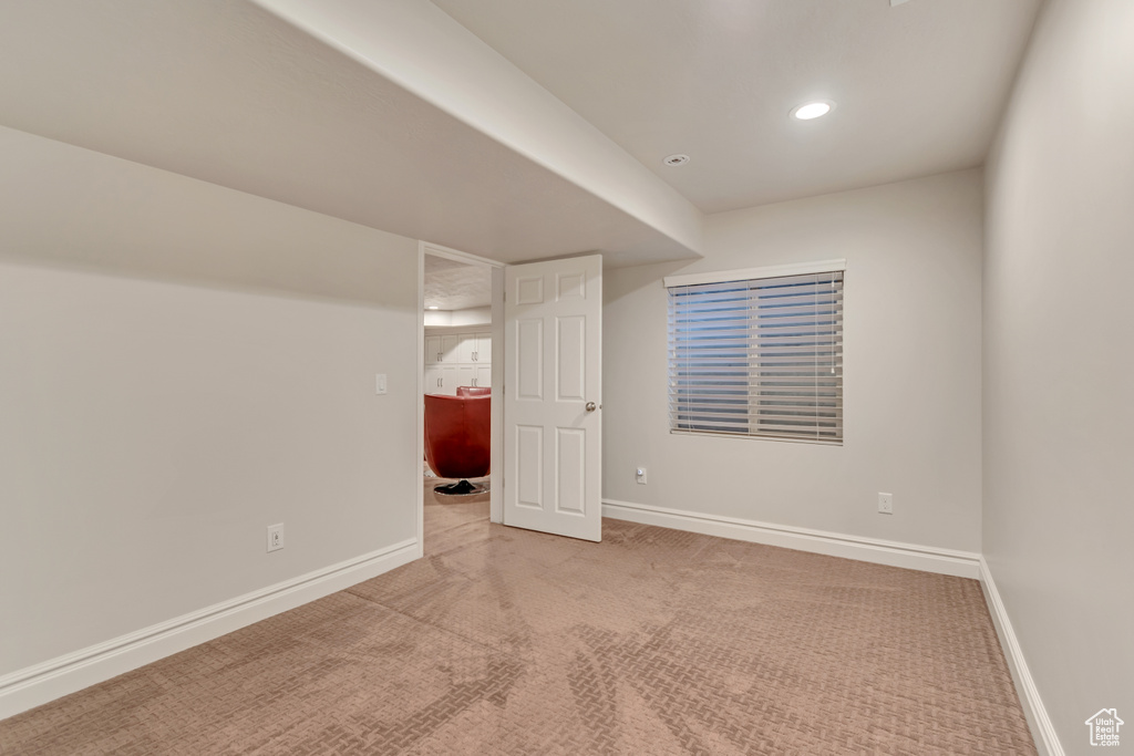 Finished basement with carpet flooring, baseboards, and recessed lighting