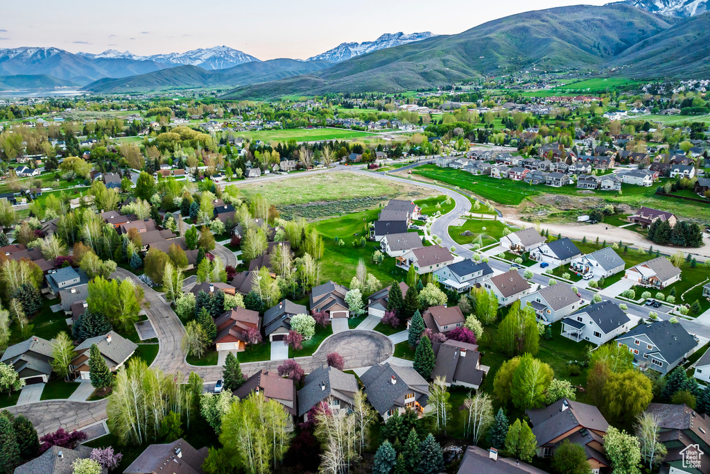Aerial perspective of suburban area featuring a mountainous background