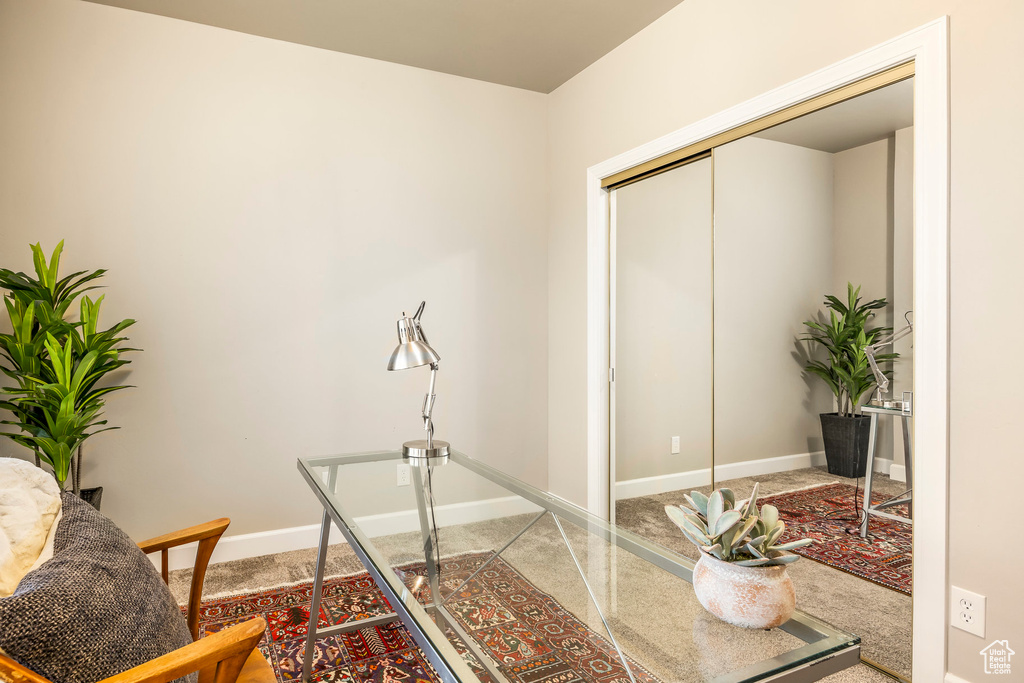 Carpeted office featuring baseboards