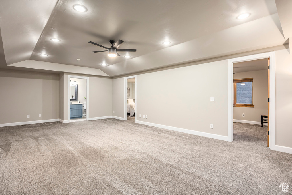 Finished basement with a ceiling fan, carpet, recessed lighting, and baseboards