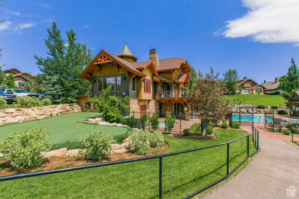 View of community featuring a pool and a patio area