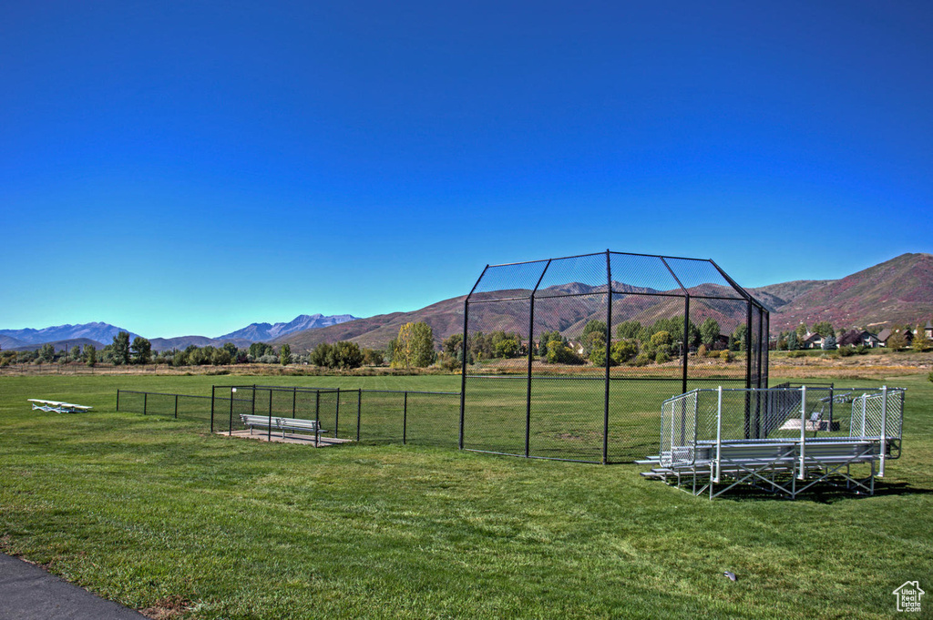 View of mountain backdrop with rural landscape
