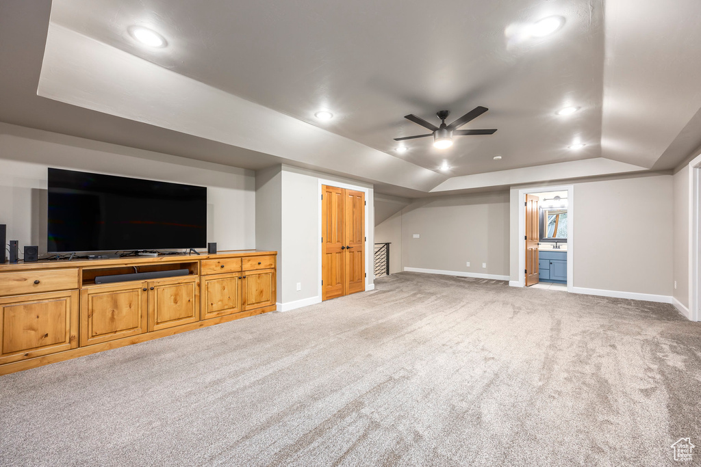 Unfurnished living room with carpet, vaulted ceiling, baseboards, a ceiling fan, and recessed lighting