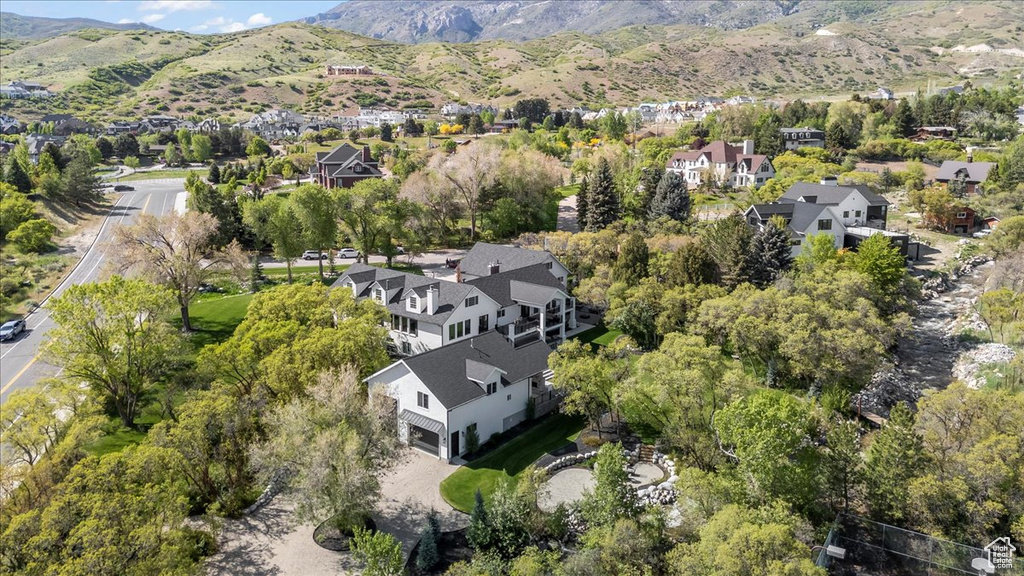 View of property location featuring a mountainous background and nearby suburban area