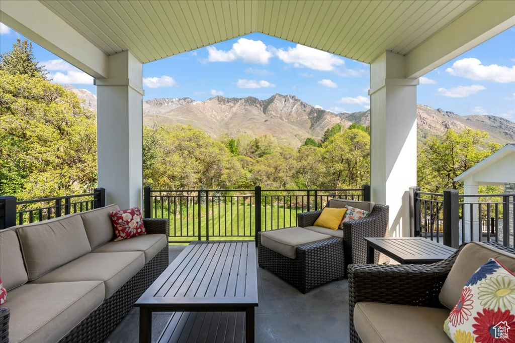 Balcony with an outdoor living space and a mountain view