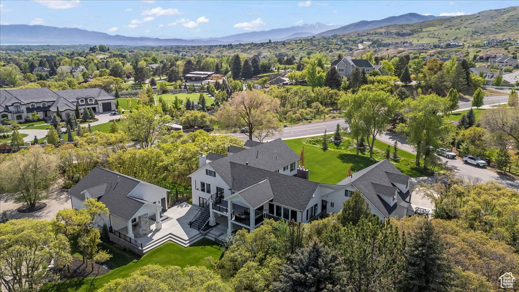 Aerial perspective of suburban area with a mountain backdrop