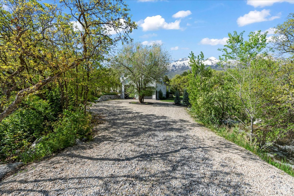 View of dirt / gravel road with a mountain view