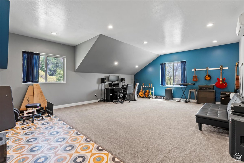 Carpeted home office with baseboards, plenty of natural light, lofted ceiling, recessed lighting, and an AC wall unit