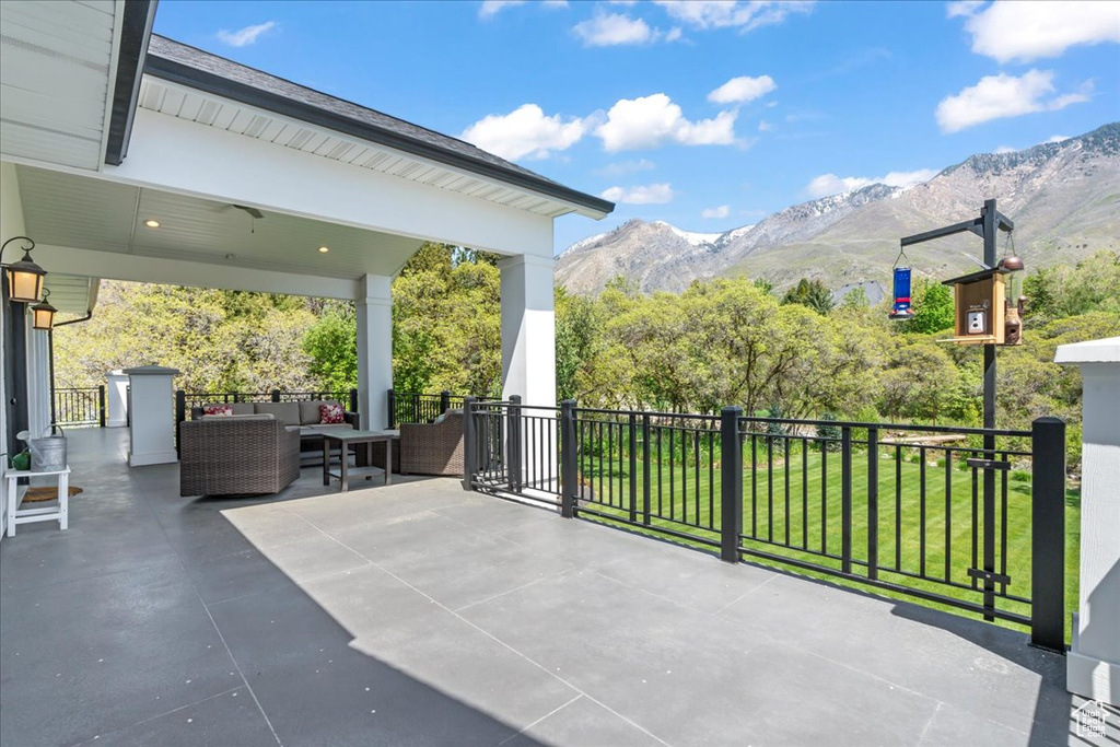 View of patio featuring a mountain view and outdoor lounge area