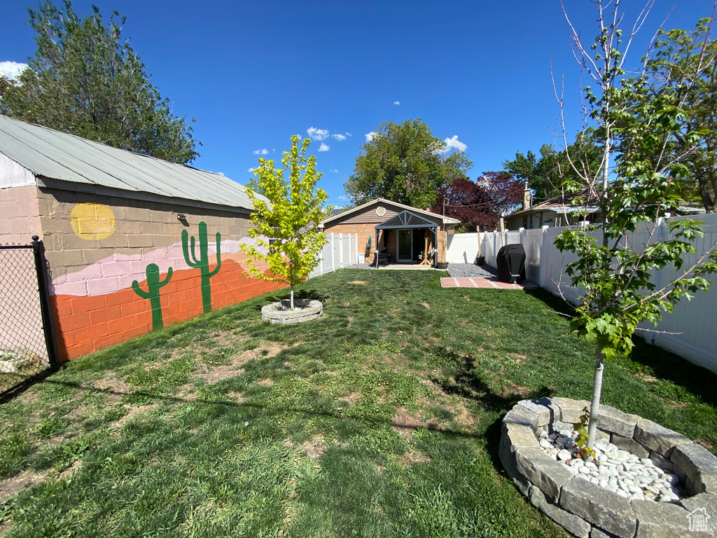 View of yard with a patio