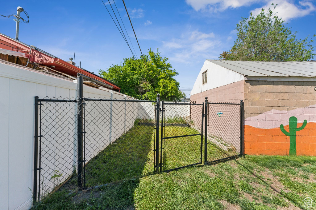 View of yard featuring a gate