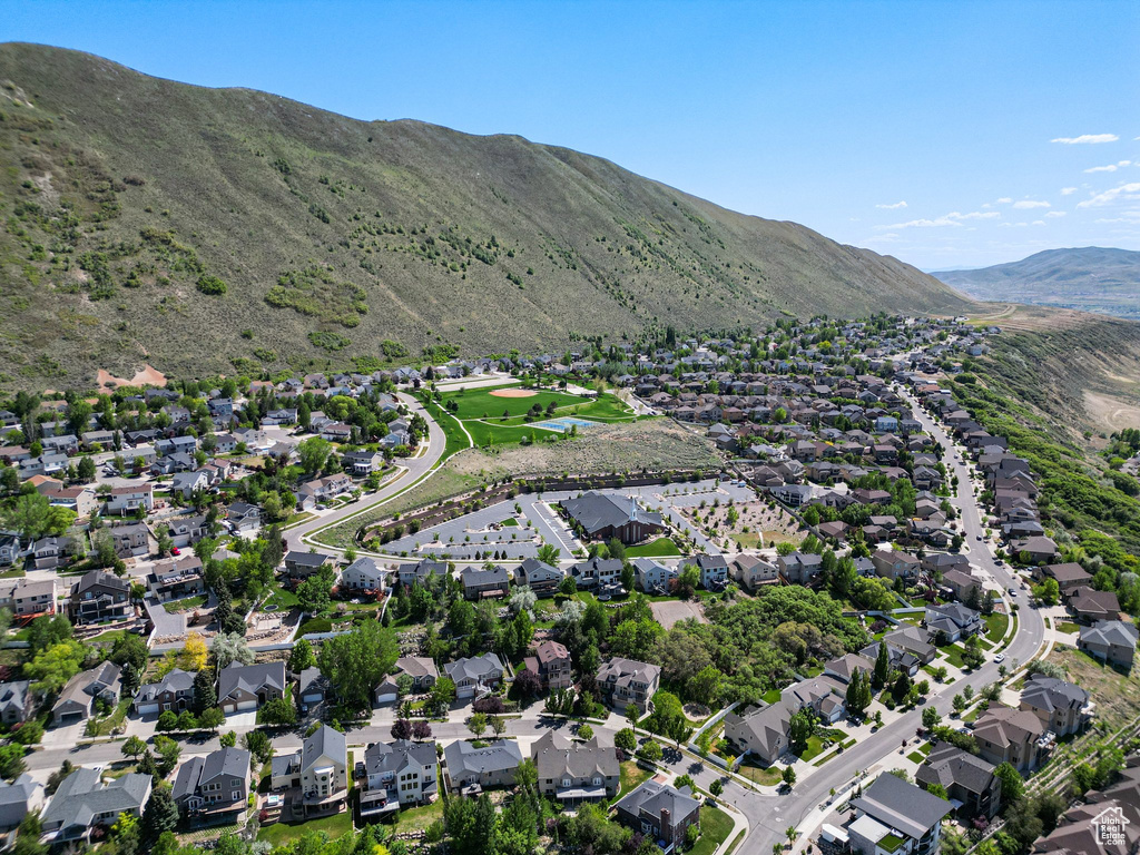 View of property location with a mountain backdrop and nearby suburban area