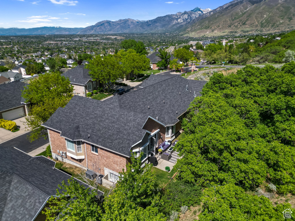 Aerial view of residential area featuring a mountainous background