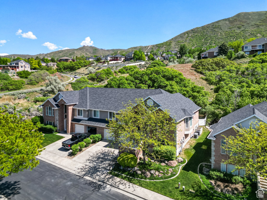 Aerial view of residential area with a mountain backdrop