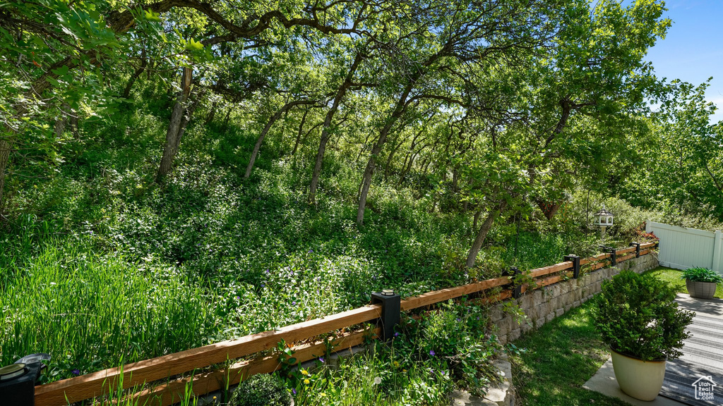 View of yard featuring fence
